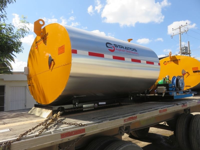 Distributor Trucks without the complexity. STRATOS DMS-1000 gallon by PavementGroup. Rear view showing an 8' spraybar, hose reel