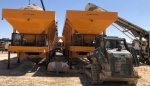 2 cold feed bins positioned end, shown with sand above the top of the bin