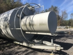Silo 40ton, portable. Part of SludgePUG pugmill system by pavementgroup.com designed for liquid waste solidification by PavementGroup.com shown with sludge bin, incline screw, pugmill and silo, easily transportable shown with axles