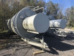 Silo 40ton, portable. Part of SludgePUG pugmill system by pavementgroup.com designed for liquid waste solidification by PavementGroup.com shown with sludge bin, incline screw, pugmill and silo, easily transportable shown with axles