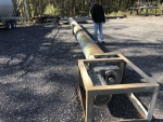 Incline screw, for liquid or sludge; part of SludgePUG pugmill system by pavementgroup.com designed for liquid waste solidification by PavementGroup.com shown with sludge bin, incline screw, pugmill and silo, easily transportable shown with axles
