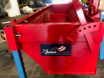 Chip Spreader, AmeriSpreader by PavementGroup shown with adjustable gate and mounting legs